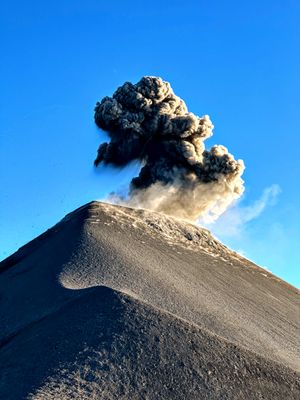 Volcan de Fuego, just outside Antigua Guatemala, erupting as it regularly does.  Seen from the saddle connecting it to Acatenango. 02/14/2024