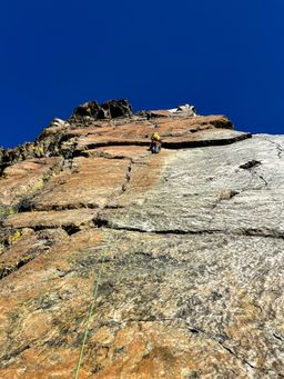 Me, putting in another piece of protection from a very good stance halfway up pitch 3.