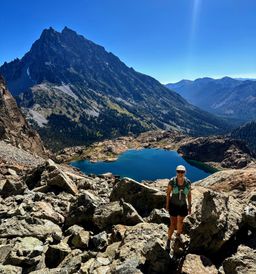 B in the scree gully, with Ingalls Lake and Mt Stuart in the background.
