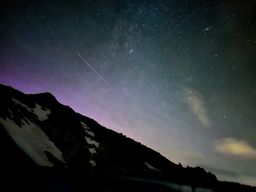 Stars and a bit of aurora in the middle of the night, taken from just outside the tent.