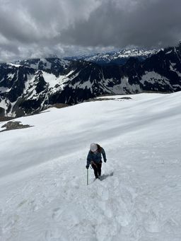 B walking up the first steep-ish snow pitch.